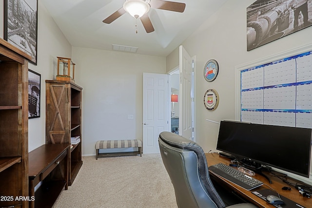 office area with visible vents, carpet, and a ceiling fan
