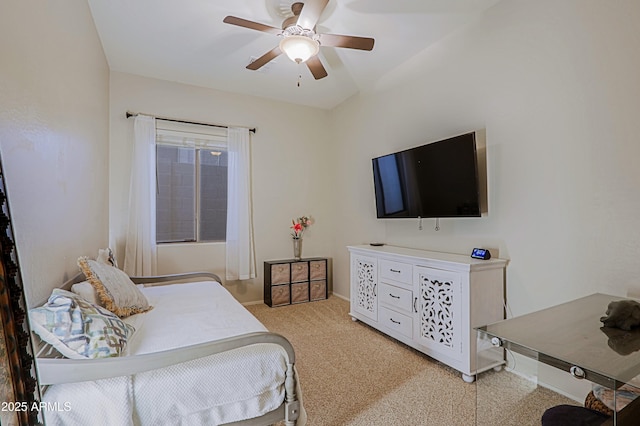 bedroom with a ceiling fan and light carpet