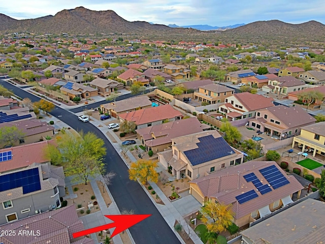drone / aerial view with a residential view and a mountain view