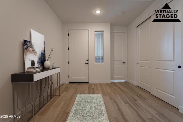 21411 W Meadowbrook Ave, Buckeye, AZ 85396 - foyer entrance featuring light wood-style flooring and recessed lighting