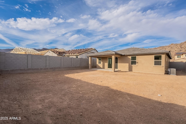 21411 W Meadowbrook Ave, Buckeye, AZ 85396 - rear view of house with a fenced backyard, stucco siding, and a patio