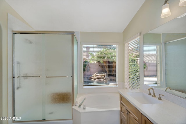 bathroom featuring vanity, a stall shower, and a bath