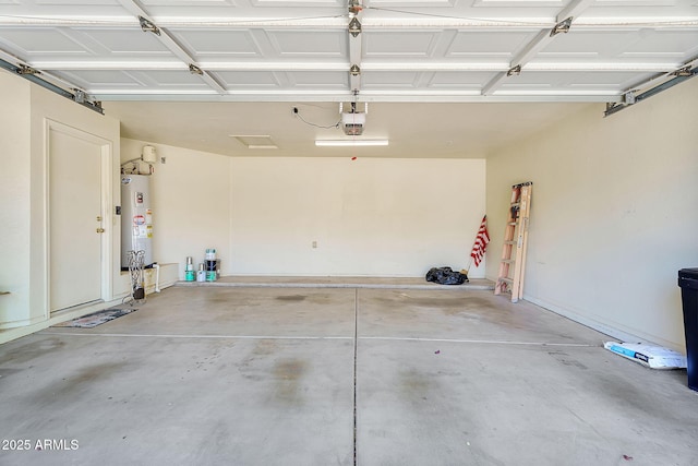 garage with water heater and a garage door opener