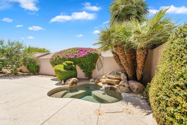 view of pool with a patio and a fenced backyard