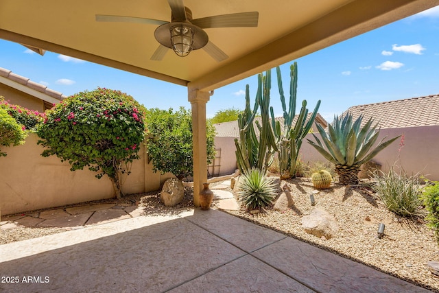 view of patio featuring a ceiling fan and a fenced backyard