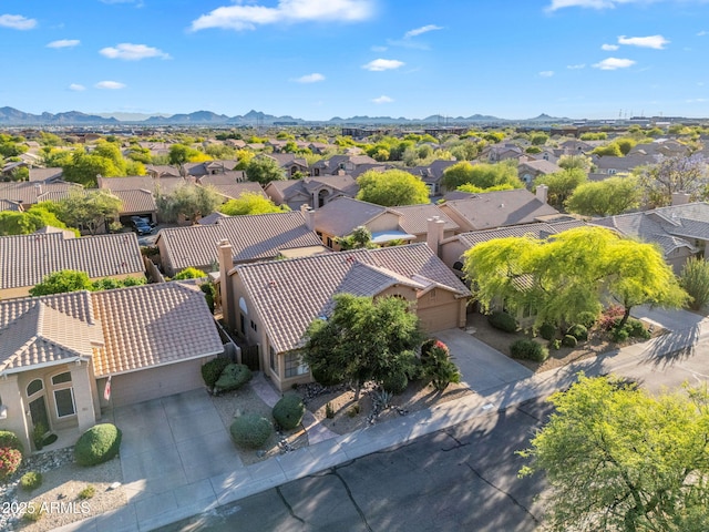 aerial view of residential area featuring a mountain backdrop