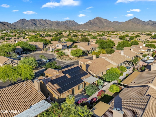 aerial view of residential area featuring a mountainous background