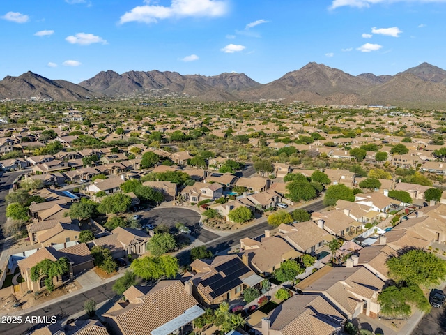 view of property location with mountains and nearby suburban area
