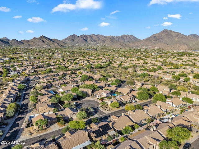 view of property location with a mountainous background and nearby suburban area