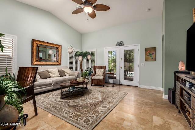 living room featuring ceiling fan, vaulted ceiling, a wealth of natural light, and french doors