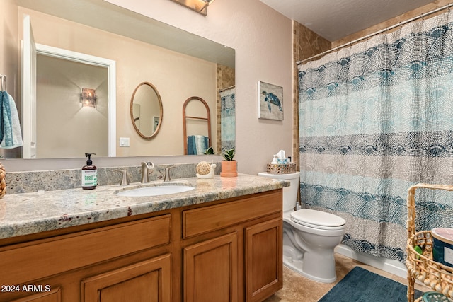 bathroom featuring tile patterned floors, vanity, toilet, and a shower with shower curtain