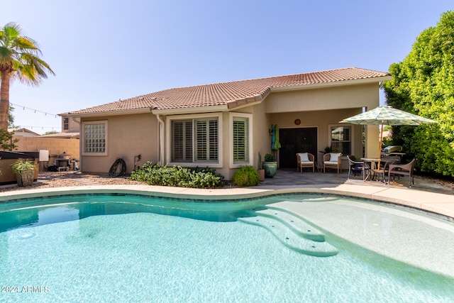 view of pool featuring a patio