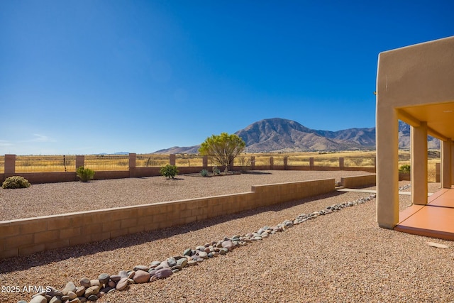 view of mountain feature with a rural view