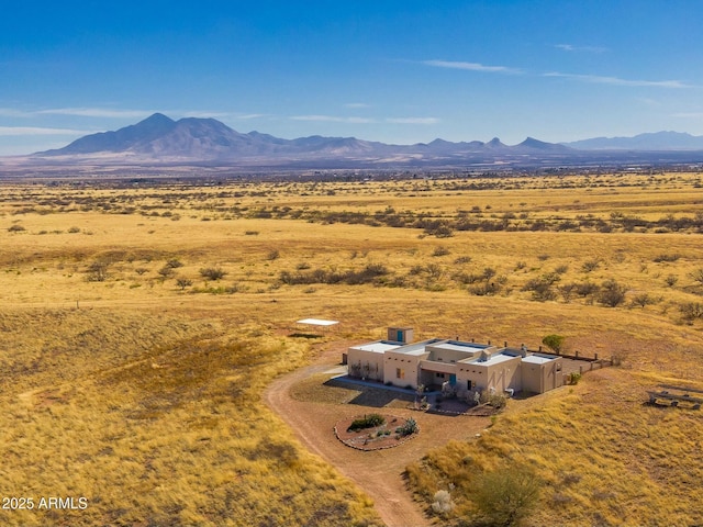 birds eye view of property featuring a mountain view