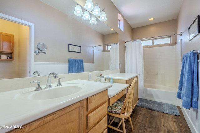 bathroom featuring hardwood / wood-style floors, shower / bath combination with curtain, and vanity