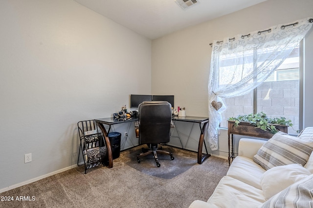 carpeted home office featuring lofted ceiling