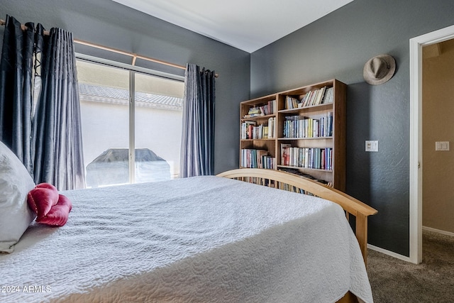 bedroom with access to exterior and carpet flooring