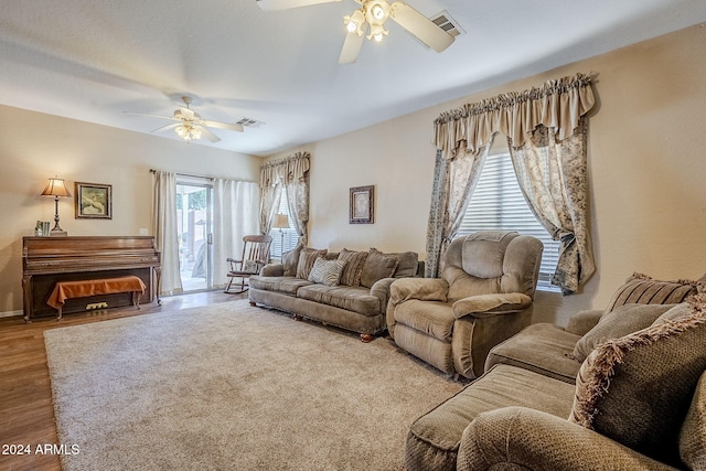 living room with hardwood / wood-style flooring and ceiling fan