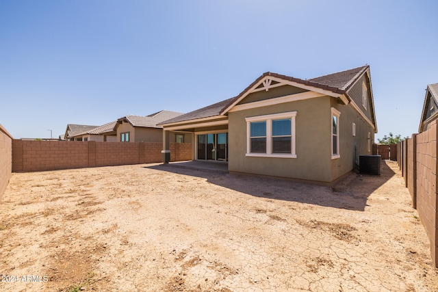 rear view of property featuring central AC and a patio area