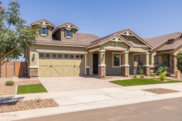 craftsman inspired home with a garage