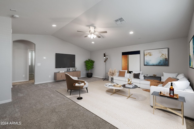 carpeted living room with vaulted ceiling and ceiling fan