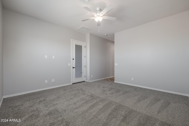 unfurnished room featuring ceiling fan and carpet floors