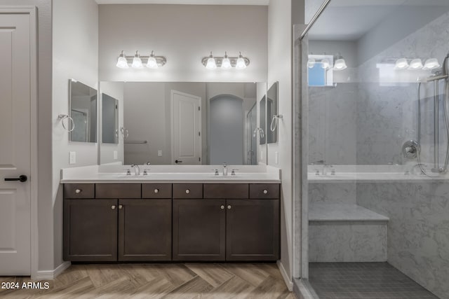 bathroom with dual vanity and parquet floors