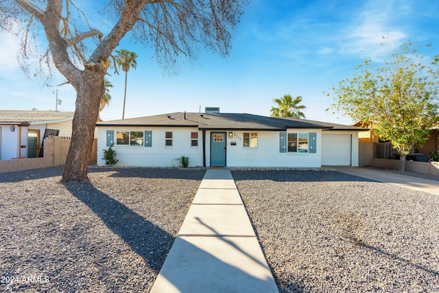 single story home with a garage