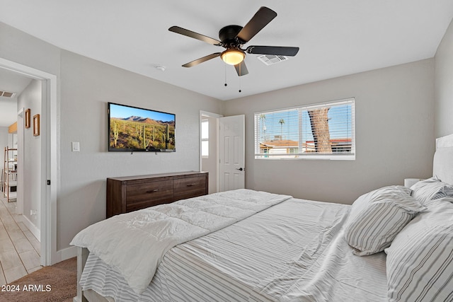 bedroom featuring ceiling fan and light wood-type flooring