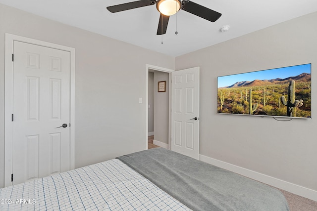 carpeted bedroom featuring ceiling fan