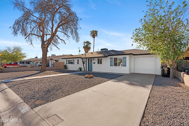 ranch-style house featuring a garage