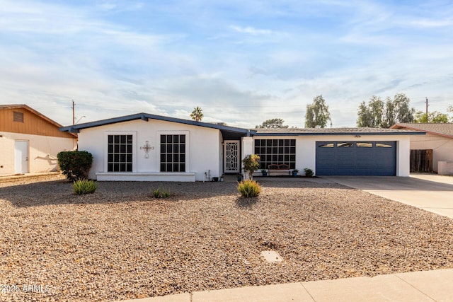 ranch-style house featuring a garage