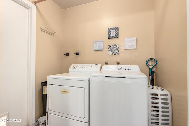 laundry room featuring separate washer and dryer