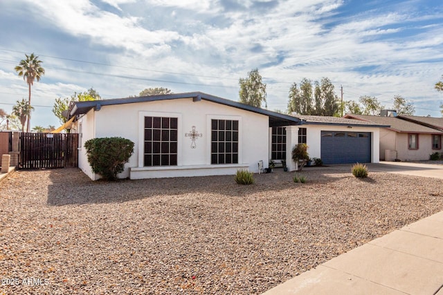 ranch-style home featuring a garage