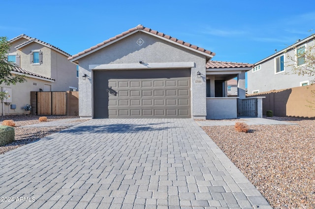 mediterranean / spanish house featuring a garage