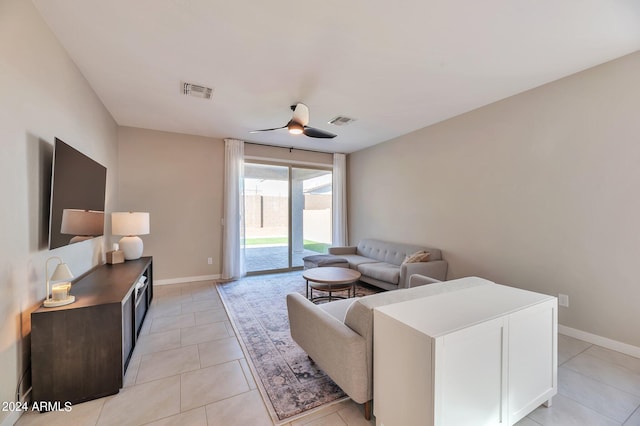 living room with ceiling fan and light tile patterned flooring