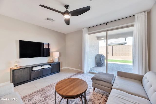 living room featuring ceiling fan and light tile patterned floors