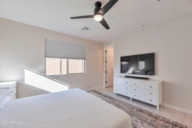 bedroom with light tile patterned floors and ceiling fan