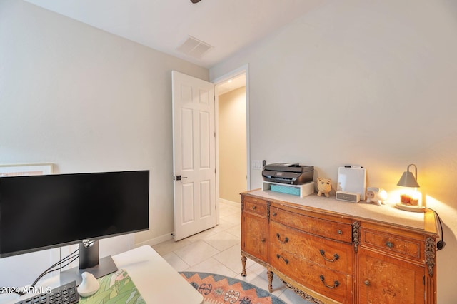 bedroom with light tile patterned floors