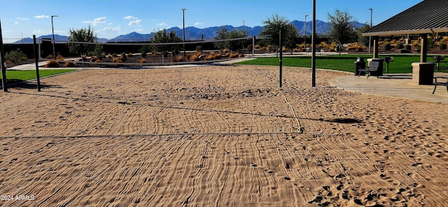 view of community featuring a mountain view and volleyball court