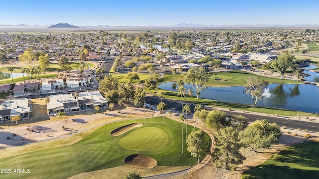 drone / aerial view featuring a water and mountain view