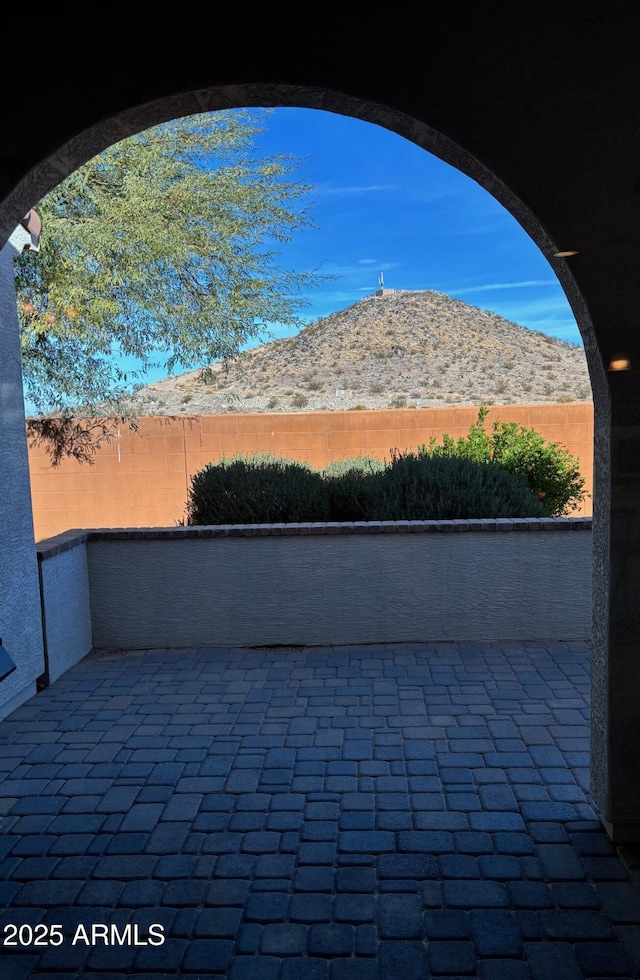 view of patio / terrace featuring a mountain view