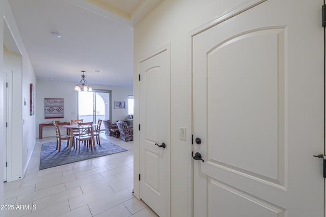 entrance foyer with an inviting chandelier