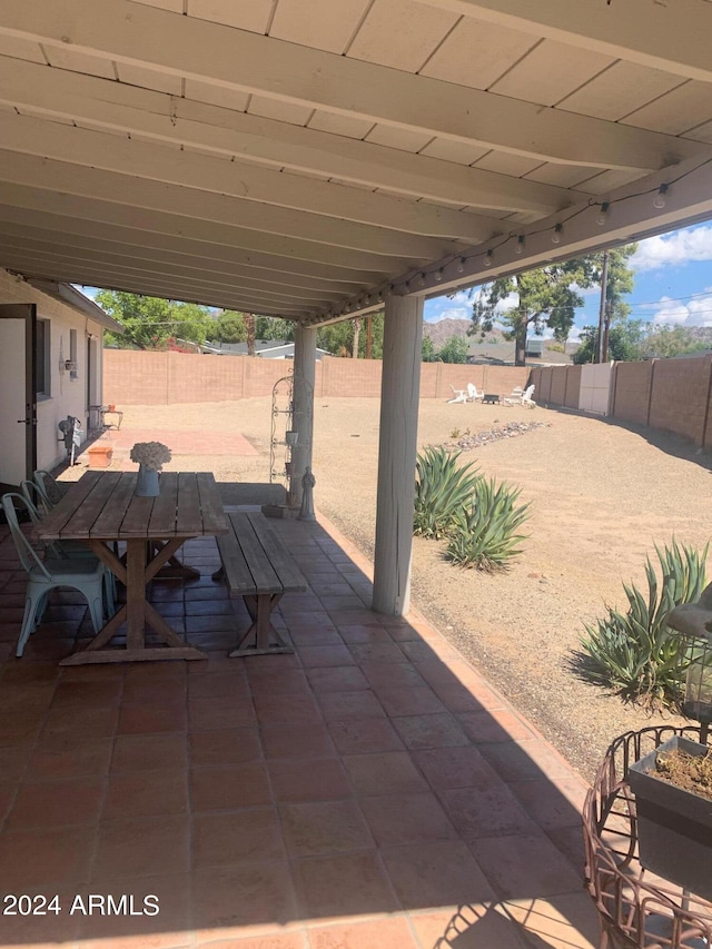 view of patio featuring outdoor dining space and a fenced backyard