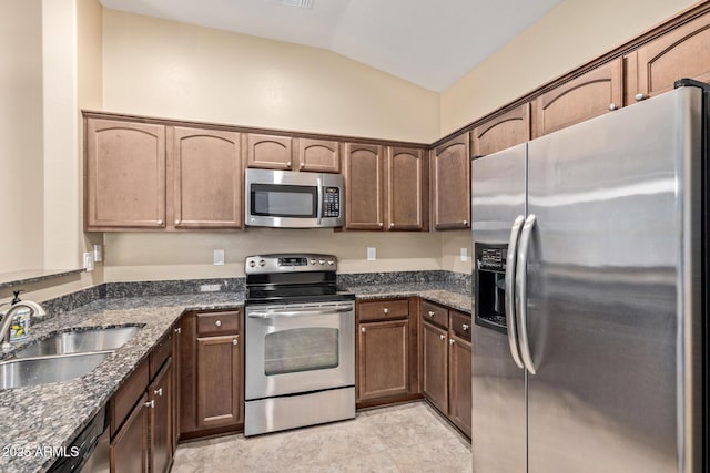 2725 E Mine Creek Rd Unit 2146, Phoenix, AZ 85024 - kitchen with stainless steel appliances, vaulted ceiling, and dark stone countertops