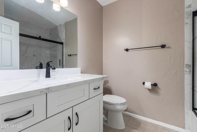 full bath featuring vanity, toilet, tile patterned flooring, and a marble finish shower