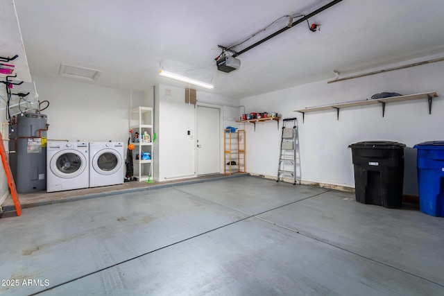 garage with electric water heater, a garage door opener, and separate washer and dryer