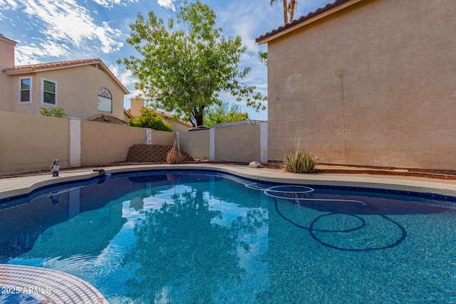 view of pool with a fenced in pool and a fenced backyard