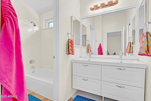 bathroom featuring double vanity, tile patterned floors, shower / tub combination, and a sink
