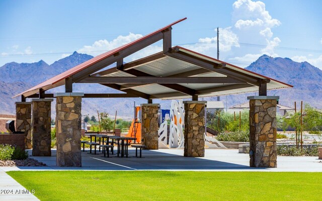 12546 W Luxton Ln, Avondale, AZ 85323 - view of community with a mountain view and a lawn